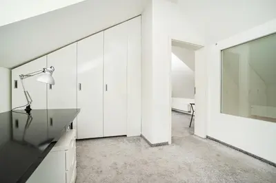 a white room with a desk and a large mirror at Luxurious 3bed very spacious apt in the best area in Prague