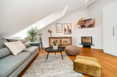 a living room with a couch and a table at Luxurious 3bed very spacious apt in the best area in Prague