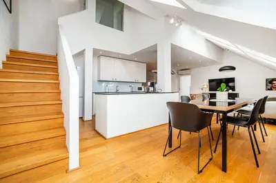 a kitchen and dining room with a table and chairs at Luxurious 3bed very spacious apt in the best area in Prague