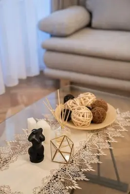 a table with a plate of yarn and a plate of cookies at Cozy flat by Wenceslas Square! in Prague