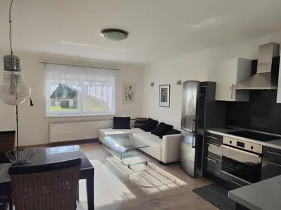 a living room with a couch and a table at Apartmán Ptice in Ptice