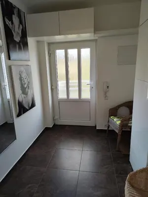 an empty room with a door and a window at Apartmán Ptice in Ptice