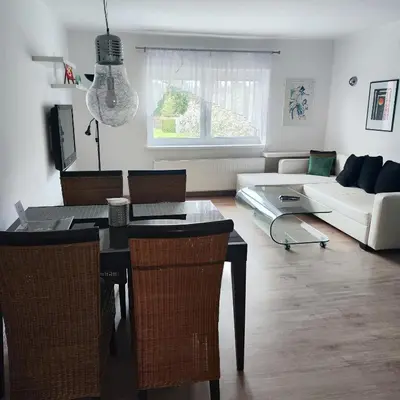 a living room with a table and a couch at Apartmán Ptice in Ptice