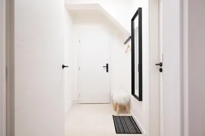a hallway with a dog sitting on a rug at U Zlaté hvězdy Jakub in Litoměřice