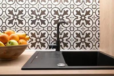 a kitchen counter with a sink and a bowl of fruit at U Zlaté hvězdy Jakub in Litoměřice
