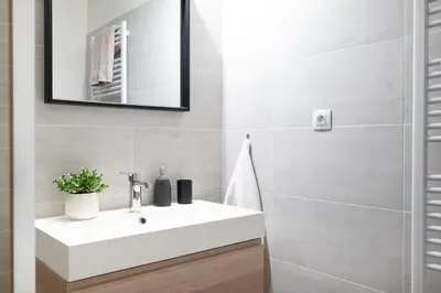 a bathroom with a white sink and a mirror at U Zlaté hvězdy Jakub in Litoměřice