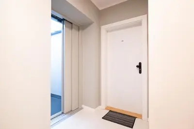 a white door in a room with a window at U Zlaté hvězdy, Karel IV in Litoměřice