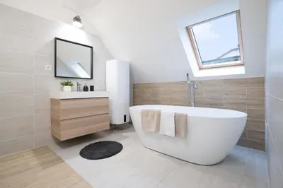 a bathroom with a white tub and a sink at U Zlaté hvězdy, Karel IV in Litoměřice