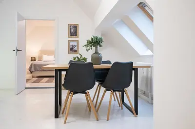 a dining room with a table and two chairs at U Zlaté hvězdy, Karel IV in Litoměřice