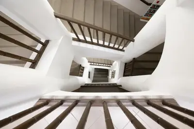 a staircase in a building with white walls at U Zlaté hvězdy, Karel IV in Litoměřice