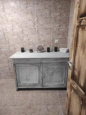 a bathroom with a counter with candles on it at Klid in Budyně nad Ohří