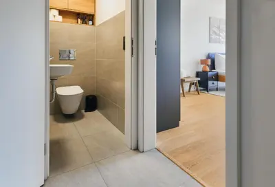 a bathroom with a toilet and a sink at Beta Home - Free Garage, Air Condition, Garden, at Metro, 2nd parking on request in Prague