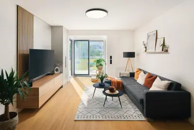 a living room with a couch and a flat screen tv at Beta Home - Free Garage, Air Condition, Garden, at Metro, 2nd parking on request in Prague