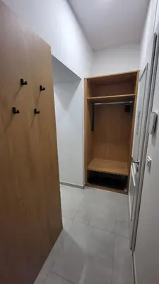 a room with a closet with a wooden door at Endless Jecna in Prague