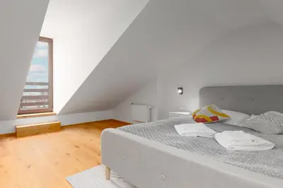 a bedroom with a bed with two towels on it at 2 rooms apartment with terrace and FREE parking near metro in Prague