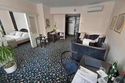a hotel room with a bed and a desk at Hotel Esprit in Prague