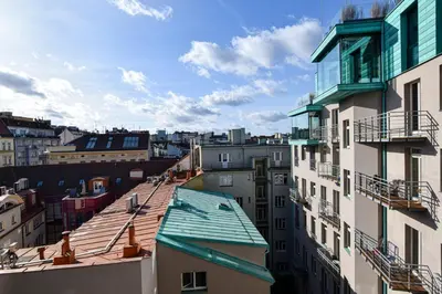 a view of the roofs of buildings in a city at Prague apartment Spalena in Prague