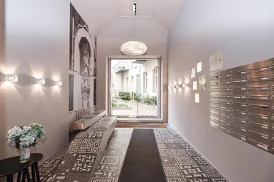 a hallway with a table and a window at Prague apartment Spalena in Prague