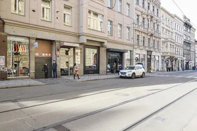 a car parked on a city street with buildings at Prague apartment Spalena in Prague