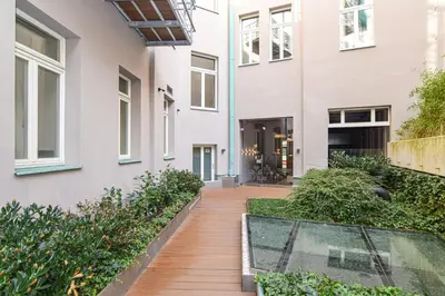 a house with a glass walkway in front of it at Prague apartment Spalena in Prague