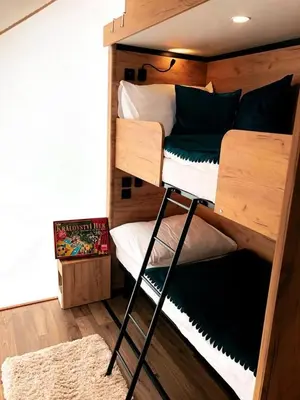a room with two bunk beds with a keyboard at Marina&Glamping Nova Zivohost in Neveklov