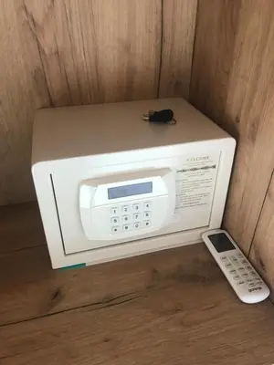 a microwave with a remote control sitting on top of it at Marina&Glamping Nova Zivohost in Neveklov