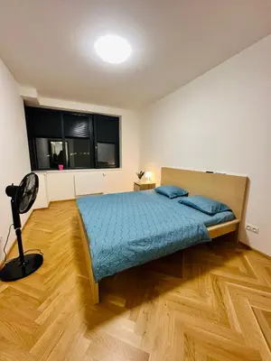 a bedroom with a bed and a lamp in it at Smichov city Apartments in Prague