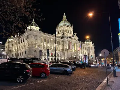 a large building with cars parked in front of it at Cozy Design Homestay right next to Wenceslas Square in Prague