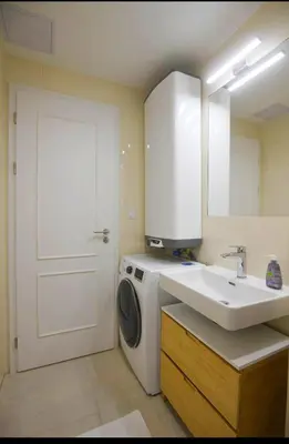 a bathroom with a washing machine and a sink at Central Studio with Private Courtyard in Prague