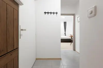 a hallway with a door leading to a bedroom at 2 bedrooms apartment near the metro in Prague