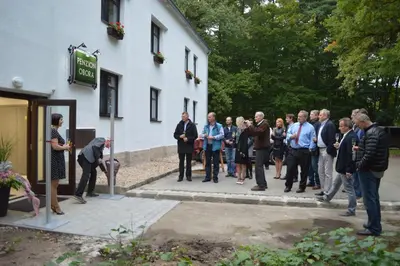 a group of people standing outside of a building at Penzion Obora in Poděbrady