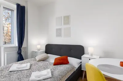 a bedroom with a bed with two pillows on it at Quiet apartment with kitchen near the metro in Prague