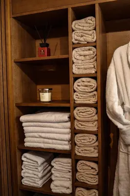 a closet filled with lots of towels at Golden Golem hotel & Spa in Prague
