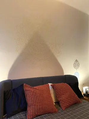 a couch with two pillows in a living room at Golem in Prague
