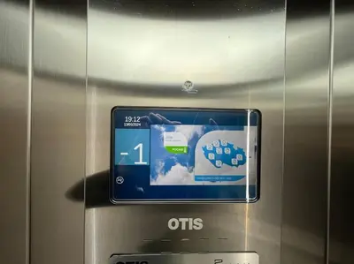 an electronic device with a picture of a car on it at Modern Apartment • Garden • Near The City Center in Prague