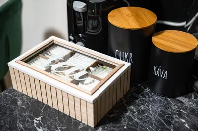 a box of knives on a counter next to a coffee maker at Secret Budget Studio Oasis in Prague