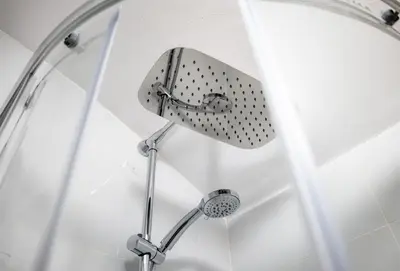 a shower with a shower head in a bathroom at Secret Budget Studio Oasis in Prague