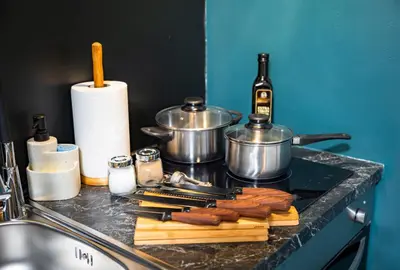a counter with a stove top with a bunch of bacon at Secret Budget Studio Oasis in Prague
