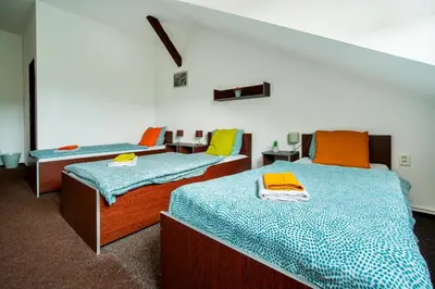 a room with two beds and a bedvisor at Ubytování Ostende - penzion in Chocerady
