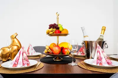 a table with plates of fruit on top of it at Brilliant Deluxe Suite in Prague