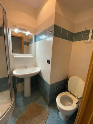 a bathroom with a toilet and a sink at 1 Bed Flat - Sleeps 2 - Pets - Smoking on terrace in Prague