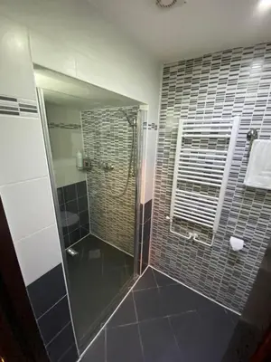 a bedroom with a bed with a computer mouse on it at Central Station Studios in Prague
