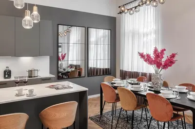 a dining room with a table and chairs at River Dance Suites by Adrez in Prague