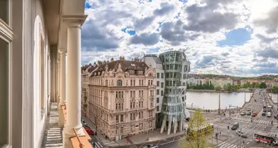 a view of a building with a glass tower at River Dance Suites by Adrez in Prague