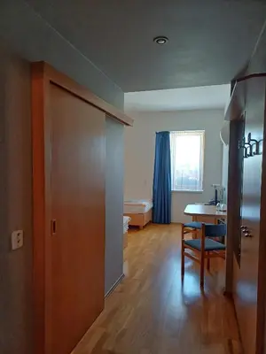 a room with a table and a room with a bedroom at Centrum Mariapoli in Prague