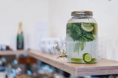 a glass jar with a lime in it on a counter at Hotel Leon in Prague