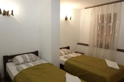 a bedroom with two beds and a window at Green Club in Tursko