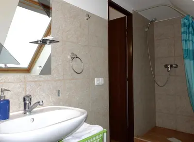 a bathroom with a sink and a shower at Green Club in Tursko