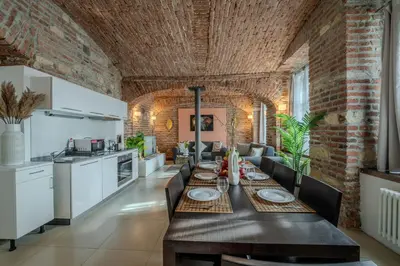 a kitchen and dining room with a table and chairs at Centre Prague Retreat Residence in Prague