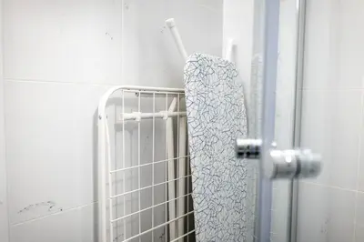 a towel hanging on a towel rack in a bathroom at Secret Economy Studio Oasis in Prague